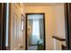Hallway view into bedroom with natural light filtering through the curtains, creating a serene atmosphere at 19044 E 16Th Ave, Aurora, CO 80011