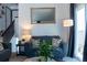 Inviting living room featuring cozy couches, stylish decor, and a staircase at 19044 E 16Th Ave, Aurora, CO 80011