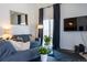 Bright living room featuring a comfortable couch, stylish decor, and natural light at 19044 E 16Th Ave, Aurora, CO 80011
