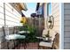 Charming outdoor patio with cozy seating and lovely potted plants at 19044 E 16Th Ave, Aurora, CO 80011