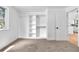 Spacious bedroom with a window and closet, featuring neutral walls and carpet at 4556 S Pagosa Way, Aurora, CO 80015