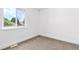 Bright bedroom featuring a window with natural light, neutral walls and carpet at 4556 S Pagosa Way, Aurora, CO 80015