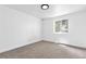 Bright bedroom with a window, neutral walls, overhead light and carpet at 4556 S Pagosa Way, Aurora, CO 80015