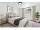 Calm and inviting bedroom with neutral color palette, plush bedding, and stylish decor at 4556 S Pagosa Way, Aurora, CO 80015