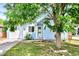 Charming home with a green front lawn, driveway, lush trees and pleasant curb appeal at 4556 S Pagosa Way, Aurora, CO 80015