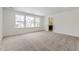Clean bedroom featuring plush carpeting and large window bringing in natural light at 39877 Floyd St, Elizabeth, CO 80107