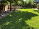 Backyard view featuring a grassy lawn, and a wooden fence at 735 Poppy Pl, Highlands Ranch, CO 80129