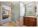 Bright bathroom featuring a modern glass shower, granite counters, and decorative tile work at 735 Poppy Pl, Highlands Ranch, CO 80129