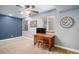 Cozy bedroom features a study area, a bright window, and modern wall decor at 735 Poppy Pl, Highlands Ranch, CO 80129