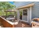 Outdoor deck features a dining table and chairs with an umbrella, a grill, and wooden railings at 735 Poppy Pl, Highlands Ranch, CO 80129