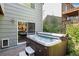 Relaxing hot tub on a brick patio with steps and landscaping around at 735 Poppy Pl, Highlands Ranch, CO 80129