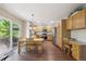 Spacious kitchen with stainless steel appliances, wooden cabinets, a large island, and plenty of counter space at 735 Poppy Pl, Highlands Ranch, CO 80129