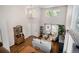 Bright living room with high ceilings, lots of natural light, and hardwood floors at 735 Poppy Pl, Highlands Ranch, CO 80129