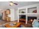 Open-concept living space with fireplace, perfect for entertaining at 735 Poppy Pl, Highlands Ranch, CO 80129