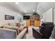 Inviting living room featuring comfortable seating and a built in entertainment center at 735 Poppy Pl, Highlands Ranch, CO 80129