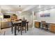 Spacious living space featuring a dining table, work space, and living room at 735 Poppy Pl, Highlands Ranch, CO 80129