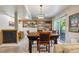Spacious living space featuring a dining table, work space, and sliding door to the exterior at 735 Poppy Pl, Highlands Ranch, CO 80129