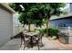 Backyard with a patio area, a dining set, and a stainless-steel grill, perfect for outdoor enjoyment at 13025 Umatilla Ct, Denver, CO 80234
