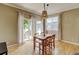 Cozy dining area with a stylish light fixture and access to the outdoors at 13025 Umatilla Ct, Denver, CO 80234