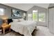 Bright main bedroom with carpet, vaulted ceilings, and large windows at 13025 Umatilla Ct, Denver, CO 80234