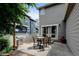 Outdoor patio with dining set, grill, and access to the backyard through sliding doors at 13025 Umatilla Ct, Denver, CO 80234