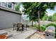 Outdoor patio with dining set, grill, and fenced yard, ideal for entertaining and relaxing at 13025 Umatilla Ct, Denver, CO 80234