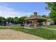 Community pool area featuring gazebo with picnic tables, grill, and other outdoor amenities at 13025 Umatilla Ct, Denver, CO 80234