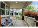 Cozy covered porch with comfortable seating, perfect for relaxing outdoors at 13025 Umatilla Ct, Denver, CO 80234