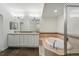Spacious bathroom with double sink vanity, tile floors, soaking tub and glass-enclosed shower at 1705 Gaylord St # 201, Denver, CO 80206