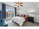 Bedroom with balcony access, ceiling fan, and comfortable decor at 1705 Gaylord St # 201, Denver, CO 80206