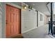 Apartment complex exterior with multiple unit doors and outdoor lighting fixtures at 1705 Gaylord St # 201, Denver, CO 80206