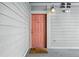 Condo exterior with front door, sconce lighting, and 'Hello Sunshine' doormat at 1705 Gaylord St # 201, Denver, CO 80206