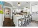 Modern kitchen with stainless steel appliances, wooden counters, and bar seating at 1705 Gaylord St # 201, Denver, CO 80206