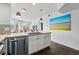 Kitchen area with breakfast bar, stainless dishwasher, and butcher block counters at 1705 Gaylord St # 201, Denver, CO 80206