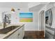 Kitchen with stainless steel fridge, butcher block counters, and modern faucet at 1705 Gaylord St # 201, Denver, CO 80206