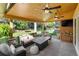 Relaxing covered patio with ceiling fans and ample seating at 7830 W Friend Pl, Littleton, CO 80128