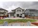 This backyard features patio space and grassy area for entertaining at 637 Millet Cir, Brighton, CO 80601