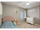 This is a comfortable and cozy bedroom with a window for natural light at 637 Millet Cir, Brighton, CO 80601