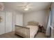 This is a charming bedroom with two closets and neutral colored walls and carpet at 637 Millet Cir, Brighton, CO 80601