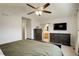 Bedroom featuring a dark wood bed frame, two dressers and ceiling fan at 637 Millet Cir, Brighton, CO 80601
