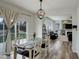 Stylish dining area with a pendant light fixture and easy access to a modern living room at 637 Millet Cir, Brighton, CO 80601