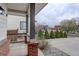 Charming front porch with brick pillars and a view of the well-maintained front yard with green landscaping at 637 Millet Cir, Brighton, CO 80601