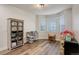 Spacious playroom featuring hardwood floors, ample natural light, and various play sets at 637 Millet Cir, Brighton, CO 80601