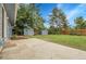 Expansive backyard with a large patio, lush lawn, storage sheds and mature trees at 3224 S Dudley St, Lakewood, CO 80227