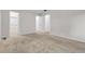 Neutral bedroom featuring plush carpeting, a closet, and convenient access to other rooms at 3224 S Dudley St, Lakewood, CO 80227