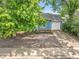 Charming one-story home with blue siding, a white garage door, and a well-maintained front yard at 3224 S Dudley St, Lakewood, CO 80227