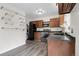 Functional kitchen with wood cabinets, sleek countertops, and modern appliances for efficient cooking at 3224 S Dudley St, Lakewood, CO 80227
