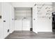 Convenient laundry area featuring side-by-side washer and dryer and ample shelving at 3224 S Dudley St, Lakewood, CO 80227