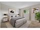 Elegant main bedroom with modern decor, a comfortable bed, and stylish bedside tables at 3224 S Dudley St, Lakewood, CO 80227