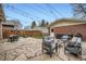 Inviting backyard features stone patio, cozy seating, and string lights, perfect for entertaining at 586 S Corona St, Denver, CO 80209